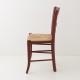 Chaise en paille rouge Oslo de profil